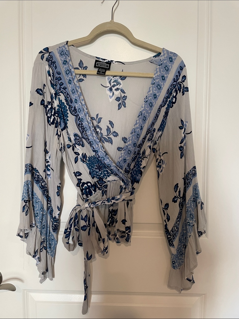 Angie Blue Floral Wrap Blouse on Light Gray